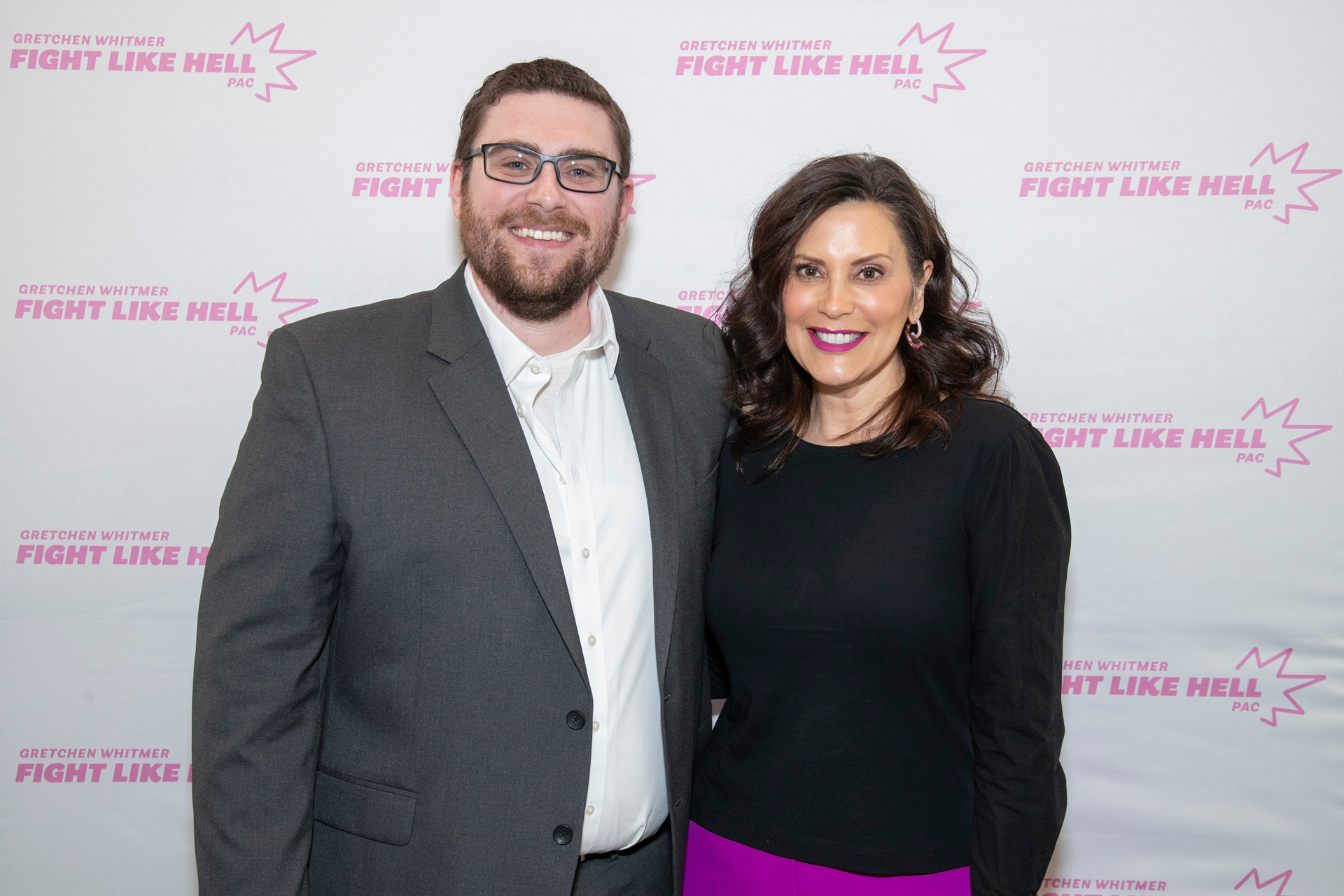 Jon LeRoux standing with Governor Gretchen Whitmer